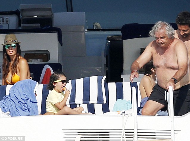 Flavio Briatore vacations on a super-yacht with his model wife and kids in Italy