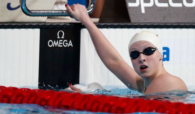 Missy Franklin opens with gold