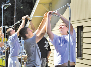 Skyline football players lend helping hand to tent city move