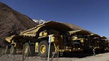 Barrick Takes Writedown, Cuts Dividend as Gold Declines