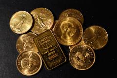 PRECIOUS-Gold falls as ECB rate view, strong US data boost dollar