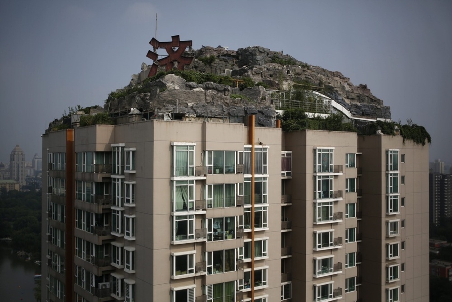 Doctor ordered to demolish 'mountain' built atop penthouse apartment in Beijing