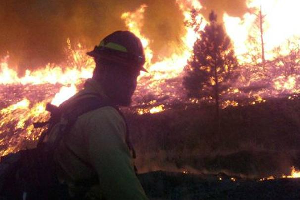 Clouds, added crews aid fight against Idaho wildfire