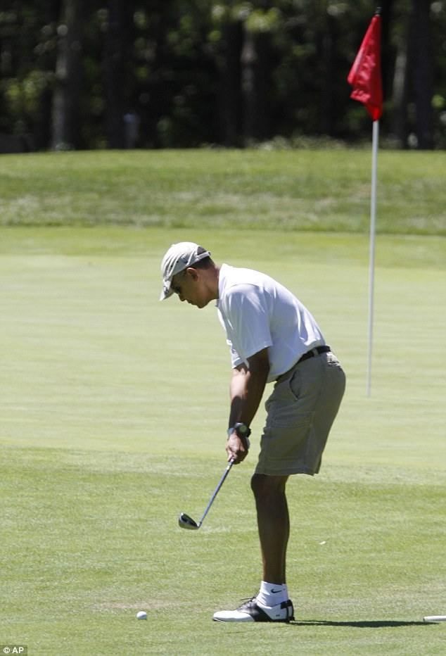 President Obama tees off his Martha's Vineyard vacation with a game of golf