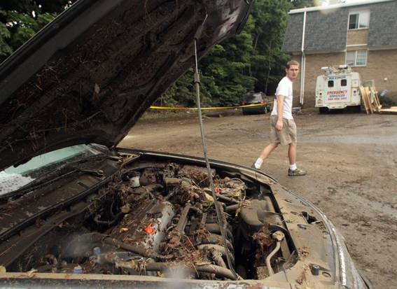 Displaced by flash flood, residents of Cranston complex return to ravaged scene