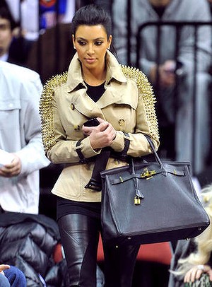 Hold it … Kim Kardashian takes her Hermès Birkin bag to a basketball game …