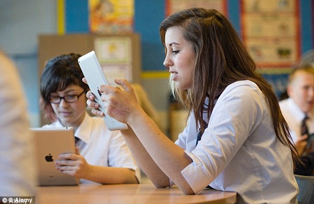 School students given free iPads unlock code and use them to play games