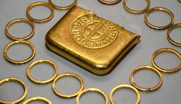 Gold rebounds on festive demand; silver remains weak