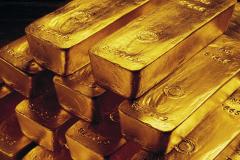 Gold hovers above $1300 on US stimulus bet