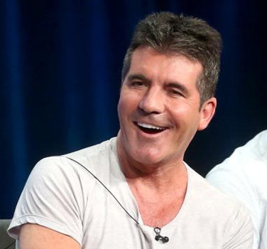 Simon Cowell confirms his child is a boy and compares babies to dogs