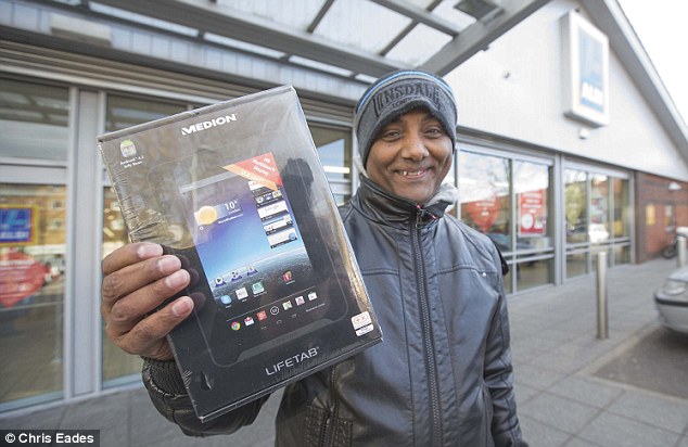 Elbows at the ready: Shoppers dash to pick up Aldi's tablet which went on sale …