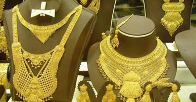 PRECIOUS-Gold holds near 6-month low; ends 2013 down 28 pct