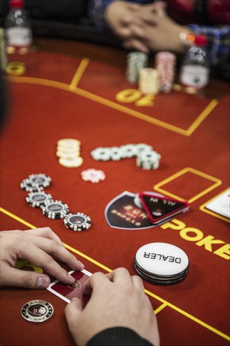 Beijing puts on its poker face