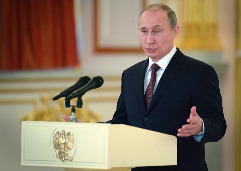 Putin rejects devaluation as ruble hits 5-year low