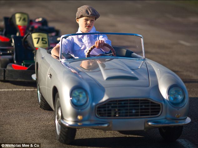 Luxury car dealer sells £16000 mini convertible Aston Martins for children