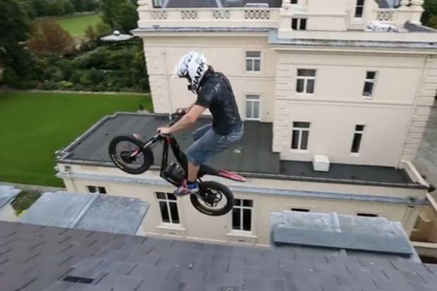 VIDEO: Daredevil biker jumps between ledges on roof of abandoned £10m …