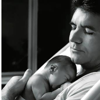 Love-struck Simon Cowell dotes on little Eric