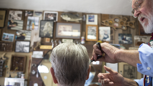 Ron Thomas has been cutting the hair of Valley elite for 50 years