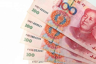 China Doubles Currency Trading Band