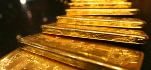 Gold prices nearly flat in Asia as Ukraine tension eases, awaits Fed
