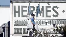 Hermes shrugs off China worries as profit climbs