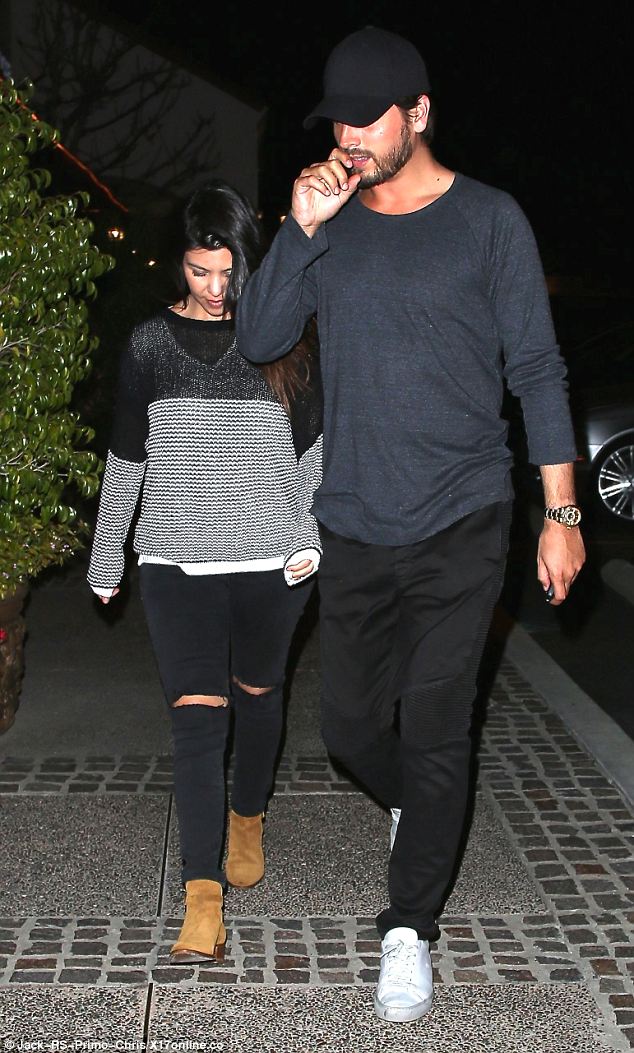 Kourtney Kardashian works ripped jeans and a striped sweater as she dines out …