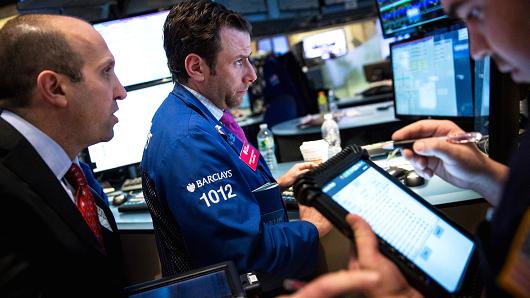 Early movers: MRK, COH, ADM, HLF, DIS, NFLX & more