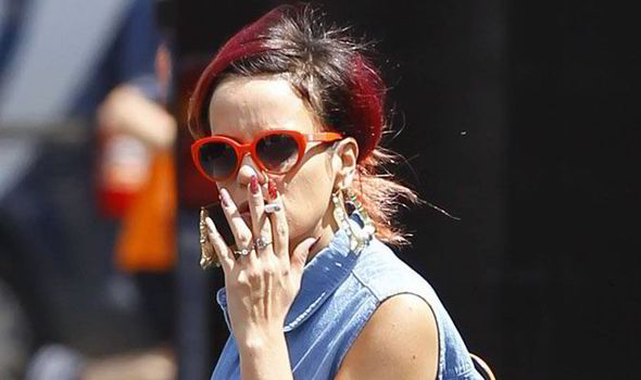 Sheezus! Lily Allen puffs on a cigarette as she shops in Agent Provocateur