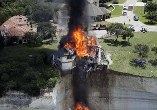 Luxury home clinging to cliff's edge burned