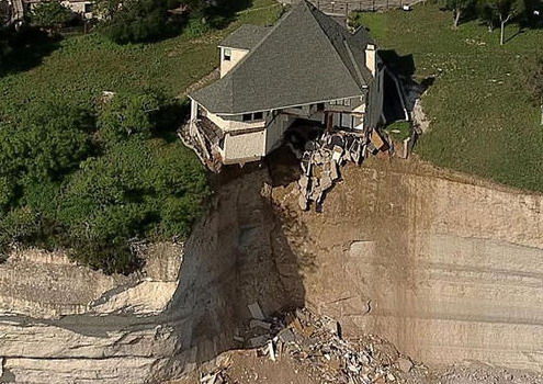 Luxury lakefront home demolished in fiery cliffhanger (Video)