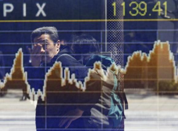 Global Markets: Asia stocks make cautious gains before data splurge