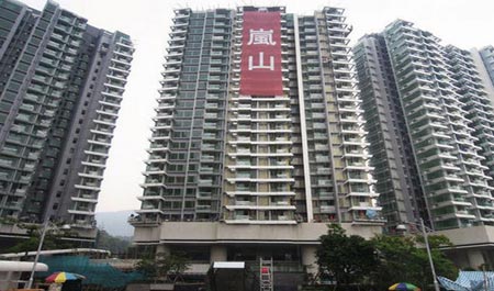 Li Ka-shing cashes in on prison cell-sized flats in HK