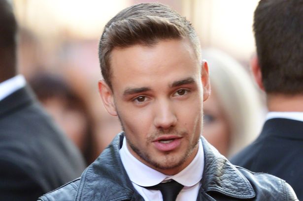 Liam Payne hits out at weight critics by donning a makeshift fat suit for a …