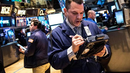 Early movers: KORS, BRK, GS, GM, MSFT, MCD & more