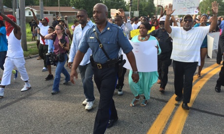 Ferguson cop who walked middle of road finds critics coming both ways