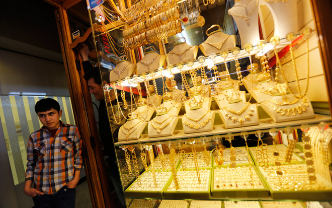 Gold price drops on poor demand, silver ends steady