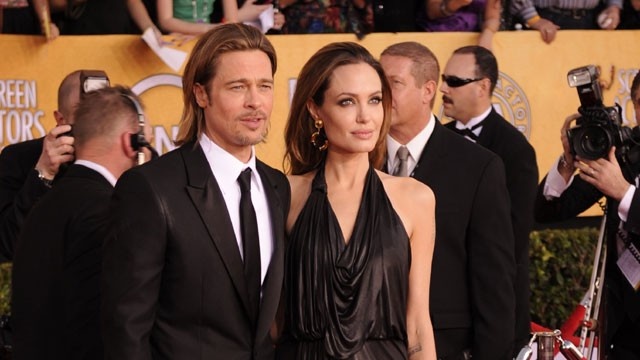 Jolie's wedding gown designed by Versace — and her kids