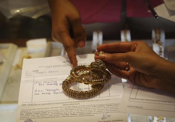 Gold buying picks up as price drops; Indian festive demand eyed