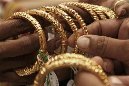 Gold slides further on selling amid lacklustre demand