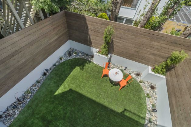 The backyard offers high privacy fences and a lawn area. Photo: Olga Soboleva …