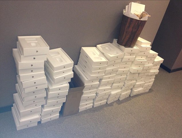 European Parliament workers as scores of empty iPad Mini boxes are pictured in …