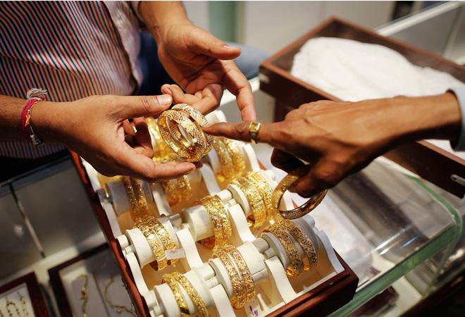 Gold price hits 14-month low, dips below 27k level