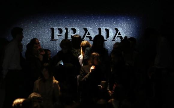 Prada to open fewer stores in 2014 after first-half profit drops