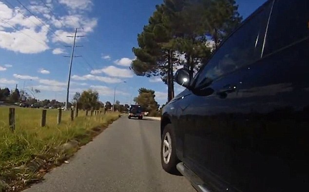 Video shows Perth cyclist almost hit by SUV driver with 'my family stickers'