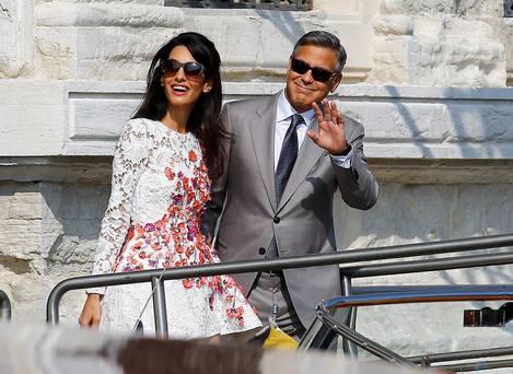 It's Mr and Mrs Clooney (and they have the bands to prove it)
