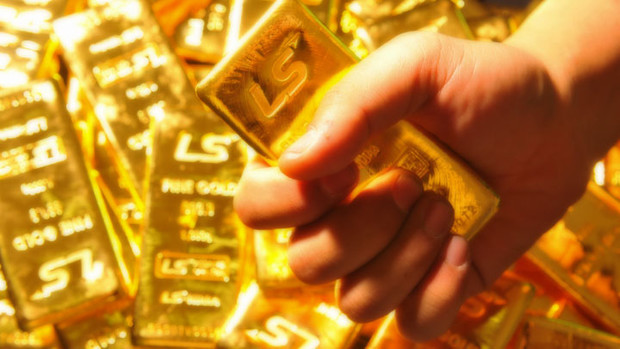 PRECIOUS-Gold rises as dollar drops; Chinese data provides boost